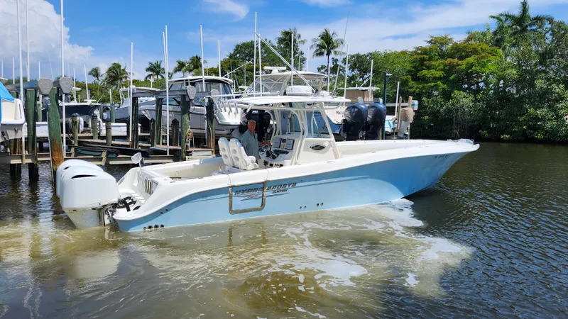 Slide: The Image of 2014 Hydra-Sports 3400 CC boat in water, tropical setting. - 2