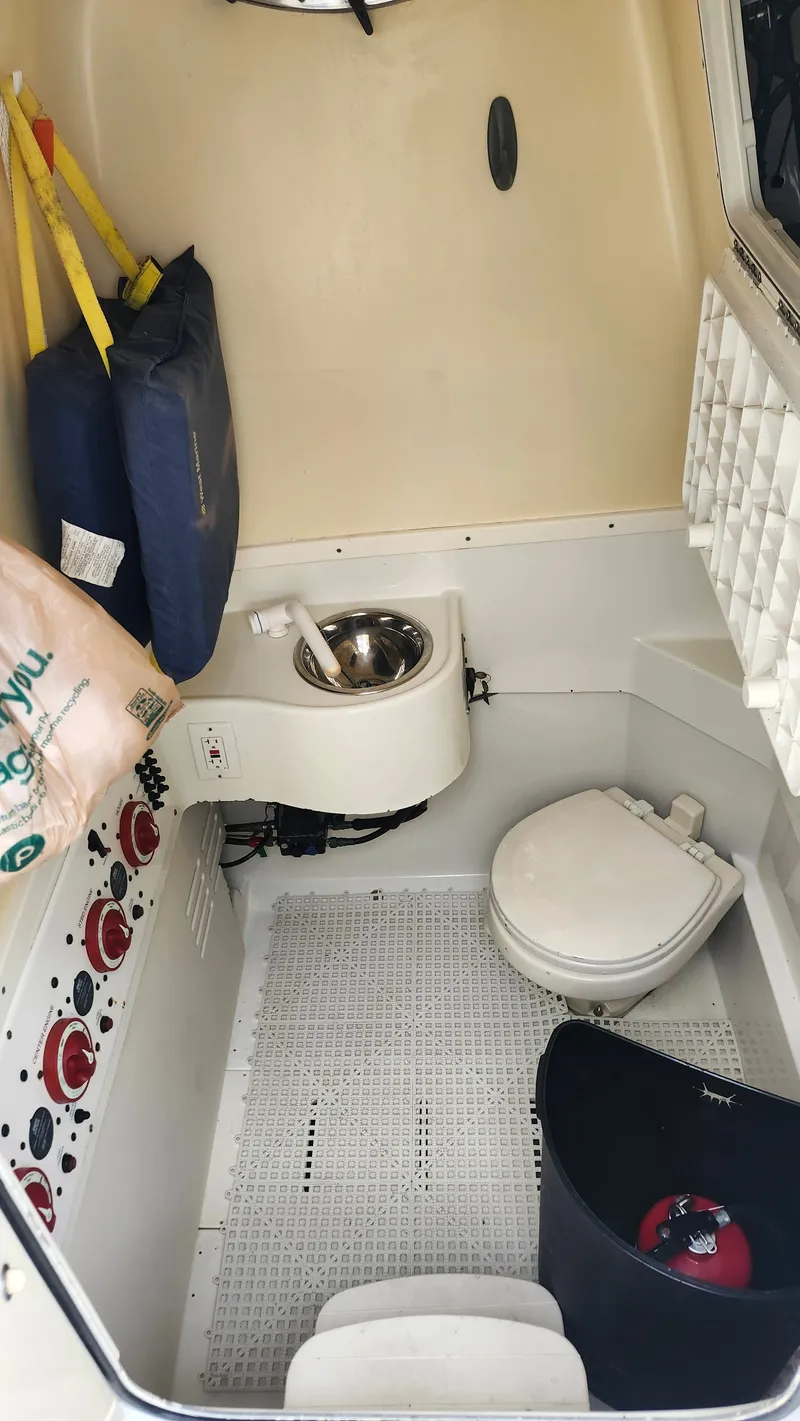 Slide: The Image of Interior of 2014 Hydra-Sports 3400 CC with toilet and sink. - 3