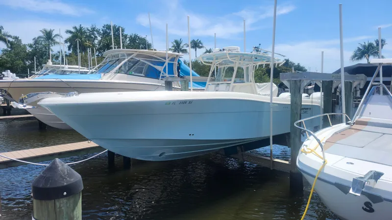Slide: The Image of 2014 Hydra-Sports 3400 CC boat docked at marina. - 4