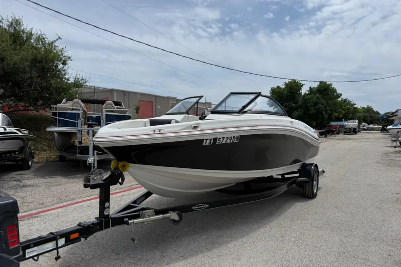 Slide: The Image of 2016 Tahoe 500 TF boat on trailer in outdoor storage area. - 1