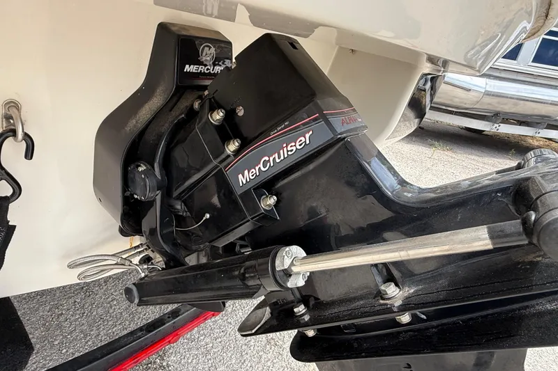 Slide: The Image of MerCruiser engine on a 2016 Tahoe 500 TF boat, showcasing the outboard motor. - 11