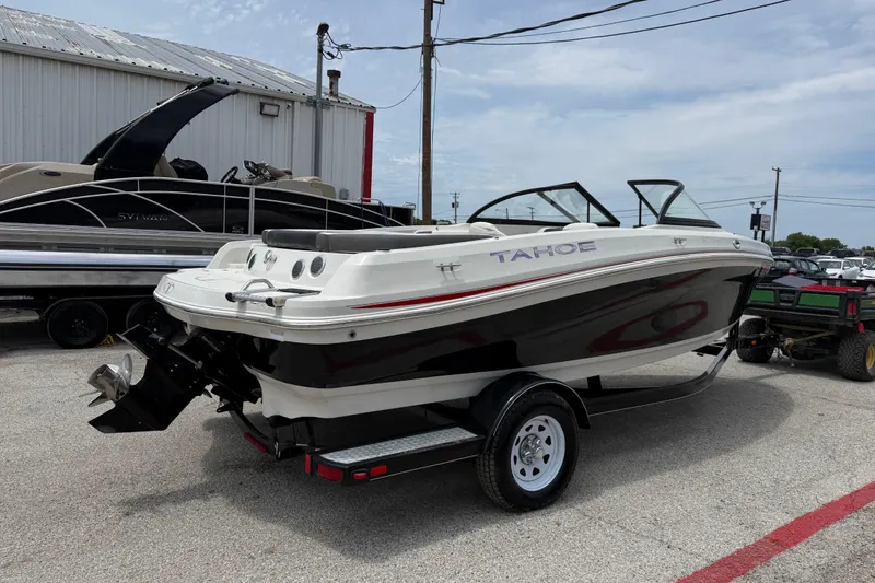Slide: The Image of 2016 Tahoe 500 TF boat on trailer in outdoor lot. - 13