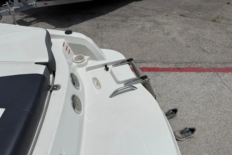 Slide: The Image of Rear view of a 2016 Tahoe 500 TF boat with swim platform and ladder. - 23