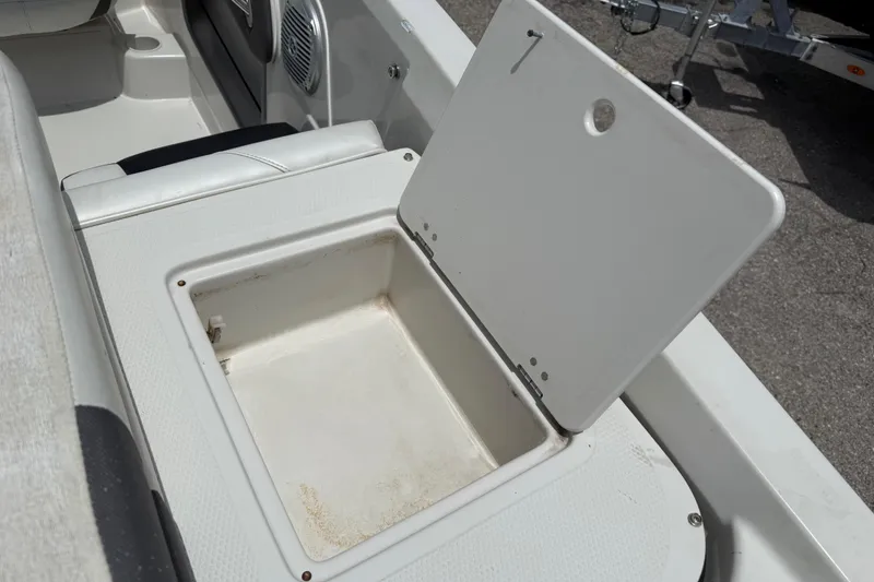 Slide: The Image of Open storage compartment in 2016 Tahoe 500 TF boat interior. - 26