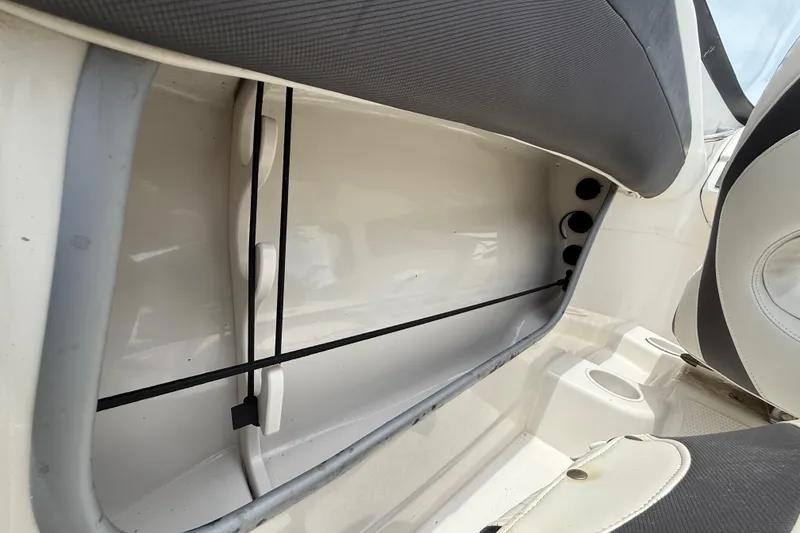 Slide: The Image of Interior storage compartment of a 2016 Tahoe 500 TF boat, featuring sleek design and seating. - 28