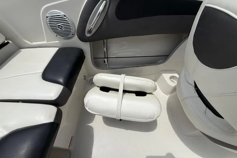 Slide: The Image of Interior of a 2016 Tahoe 500 TF boat, featuring white and black seating. - 29