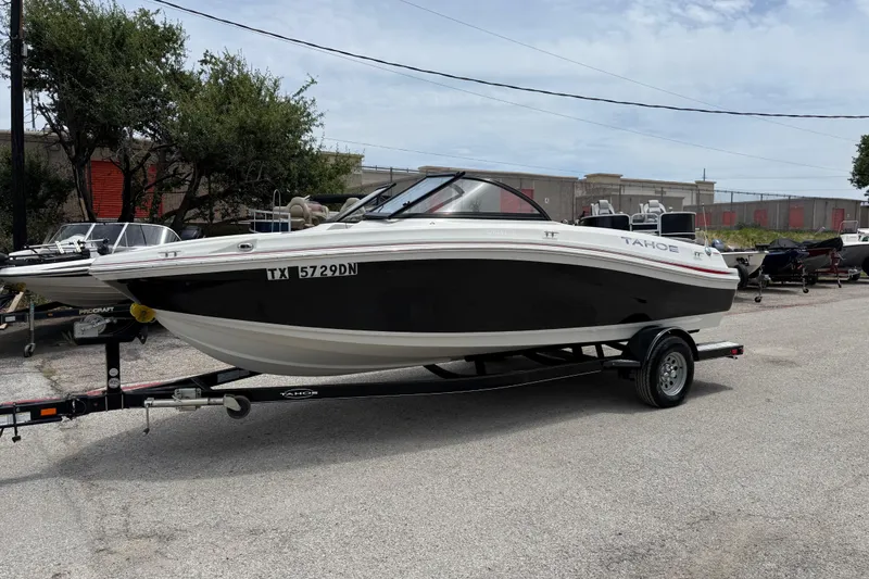 Slide: The Image of 2016 Tahoe 500 TF boat on trailer, parked outdoors, side view. - 3