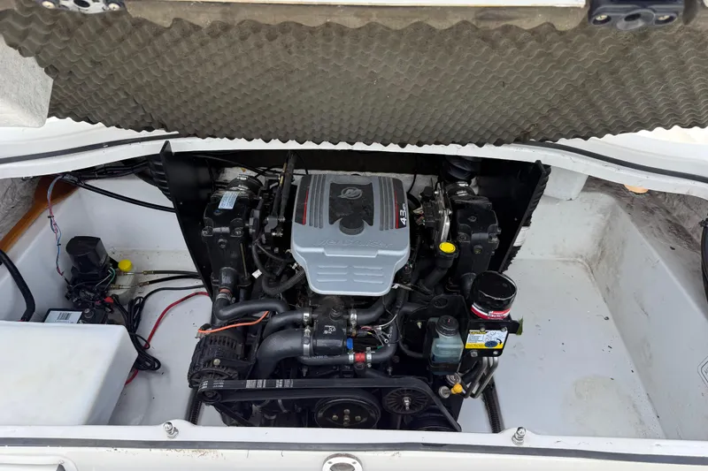 Slide: The Image of Engine compartment of a 2016 Tahoe 500 TF boat, showcasing detailed mechanical components. - 32