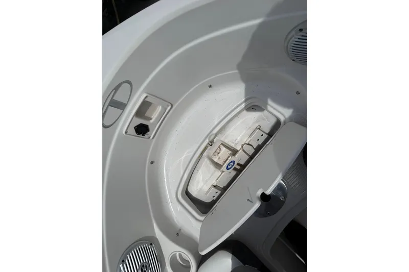 Slide: The Image of Interior view of a 2016 Tahoe 500 TF boat, featuring storage compartment and speaker. - 37