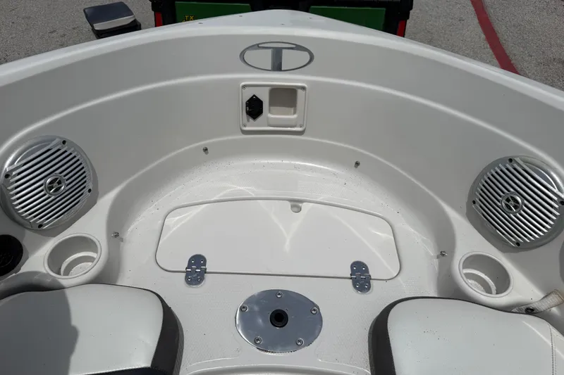 Slide: The Image of Interior of a 2016 Tahoe 500 TF boat with speakers and cup holders. - 38