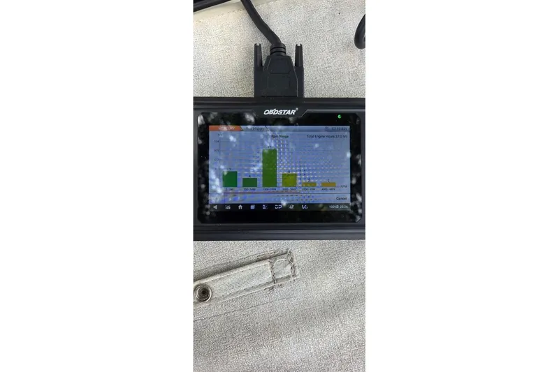 Slide: The Image of OBDSTAR diagnostic tool displaying engine data for 2016 Tahoe 500 TF. - 4