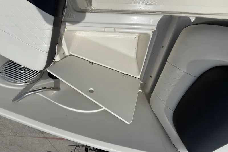 Slide: The Image of Interior view of a 2016 Tahoe 500 TF boat, featuring seating and storage compartment. - 44