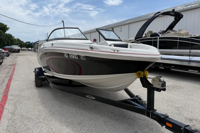 Slide: The Image of 2016 Tahoe 500 TF boat on trailer in outdoor storage area. - 5