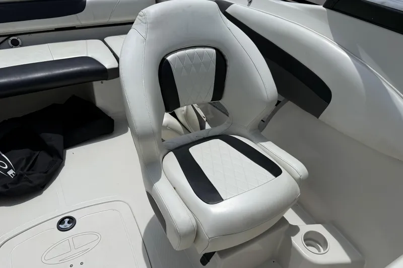 Slide: The Image of White and black cushioned seat on a 2016 Tahoe 500 TF boat interior. - 50