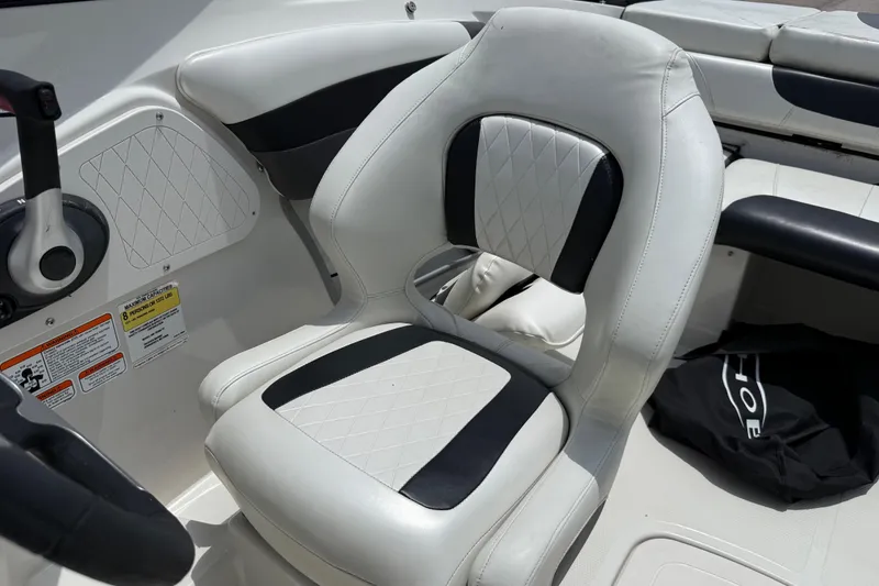 Slide: The Image of White and black seat in 2016 Tahoe 500 TF boat interior. - 51