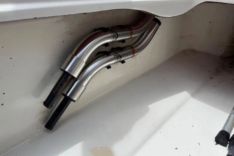 Slide: The Image of Stainless steel exhaust pipes in a 2016 Tahoe 500 TF boat. - 53