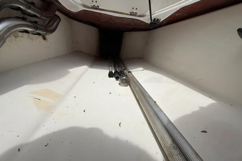 Slide: The Image of Interior view of a 2016 Tahoe 500 TF boat compartment with metal pipes. - 54