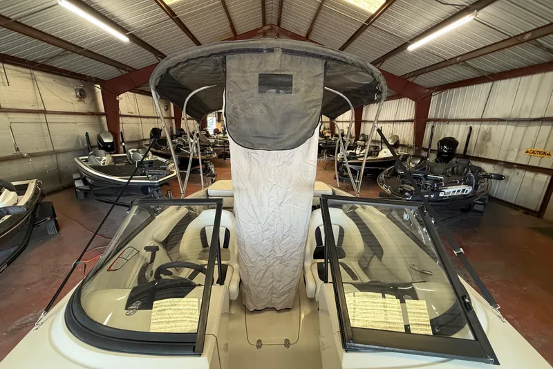 Slide: The Image of 2016 Tahoe 500 TF boat in a storage facility with multiple boats. - 61