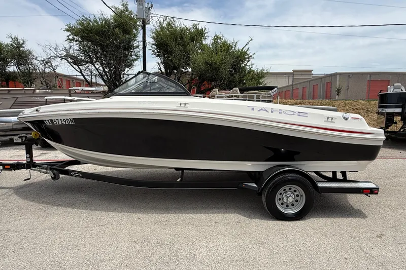 Slide: The Image of 2016 Tahoe 500 TF boat on trailer, parked outdoors. - 7