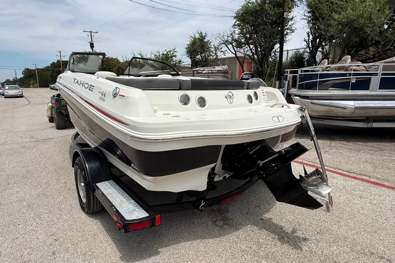 Slide: The Image of 2016 Tahoe 500 TF boat on trailer, parked outdoors. - 9