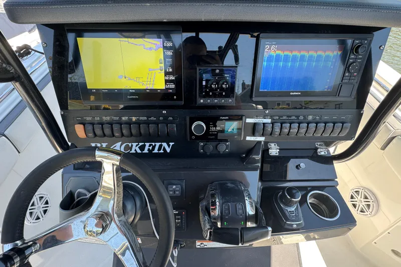 Slide: The Image of 2020 Blackfin 272 CC boat dashboard with Garmin navigation displays and controls. - 11