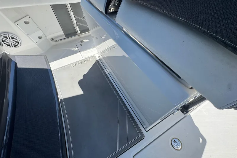 Slide: The Image of Interior view of a 2020 Blackfin 272 CC boat, showcasing seating and deck details. - 14