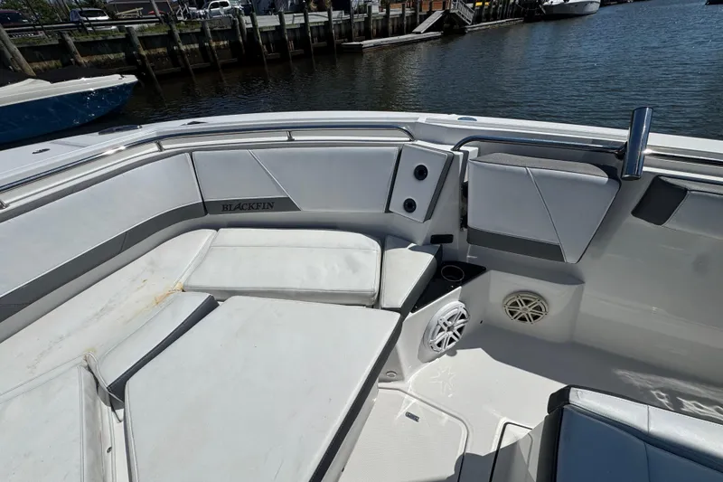 Slide: The Image of 2020 Blackfin 272 CC boat interior with cushioned seating and speaker system. - 19
