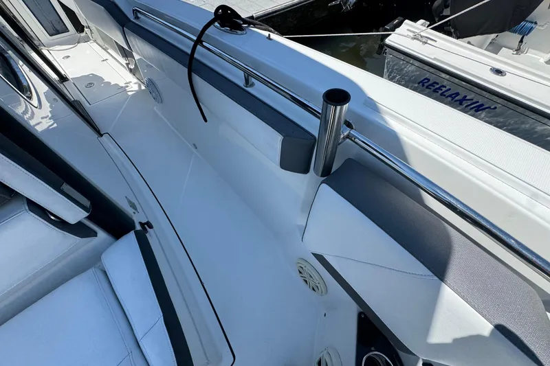 Slide: The Image of 2020 Blackfin 272 CC boat interior with sleek seating and stainless steel railings. - 23