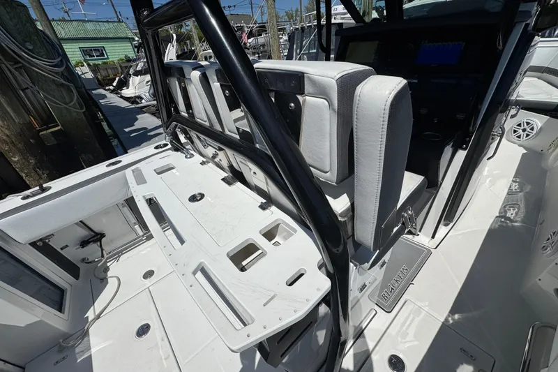 Slide: The Image of 2020 Blackfin 272 CC boat interior with seating and fishing rod holders. - 29