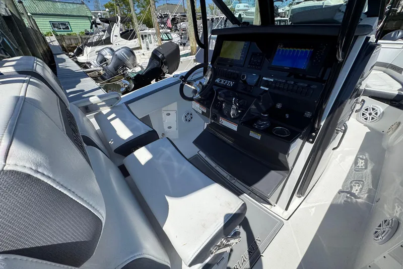 Slide: The Image of 2020 Blackfin 272 CC boat cockpit with advanced navigation controls and seating. - 30