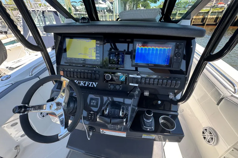 Slide: The Image of Cockpit of 2020 Blackfin 272 CC boat with advanced navigation displays and controls. - 31