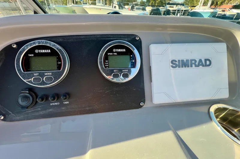 Slide: The Image of Dashboard of 2024 Robalo R207 Dual Console with Yamaha gauges and Simrad display. - 14