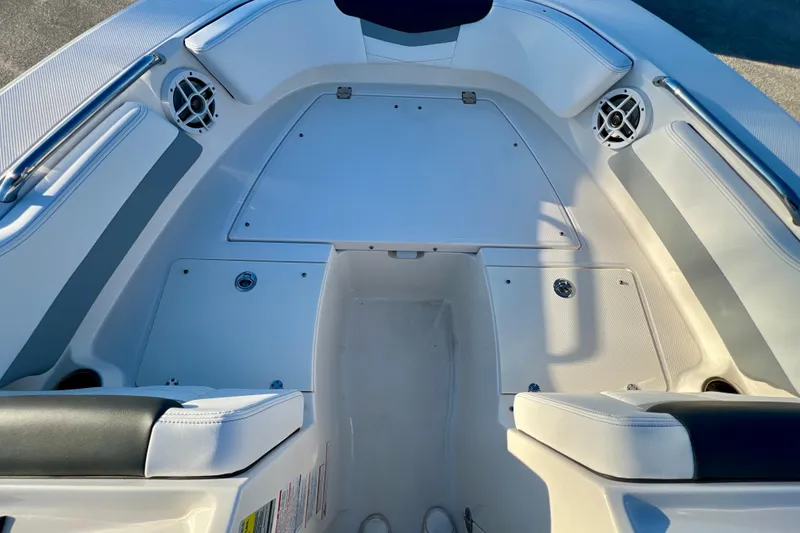Slide: The Image of 2024 Robalo R207 Dual Console boat interior with seating and storage compartments. - 20