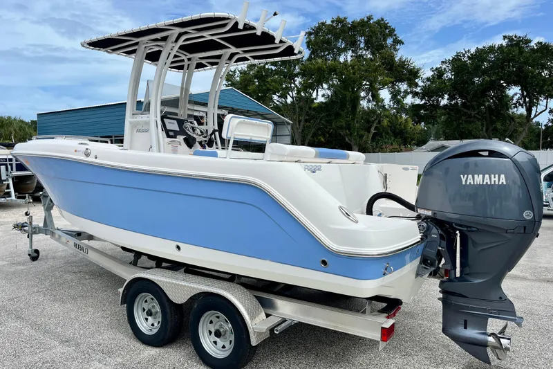 Slide: The Image of 2024 Robalo R222 Center Console boat with Yamaha engine on trailer. - 6