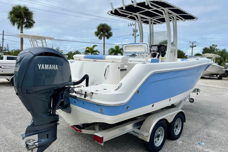 Slide: The Image of 2024 Robalo R222 Center Console boat with Yamaha engine on trailer. - 8