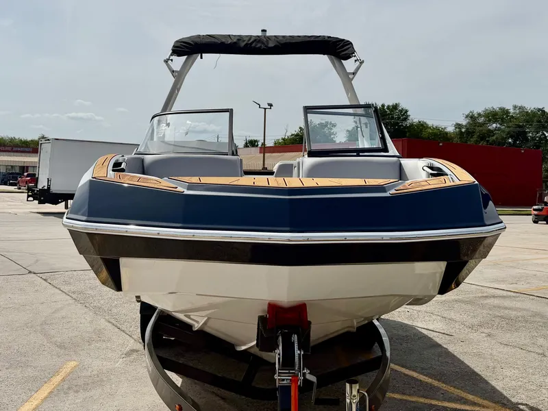 Slide: The Image of 2026 Moomba Tykon boat parked in a lot. - 3