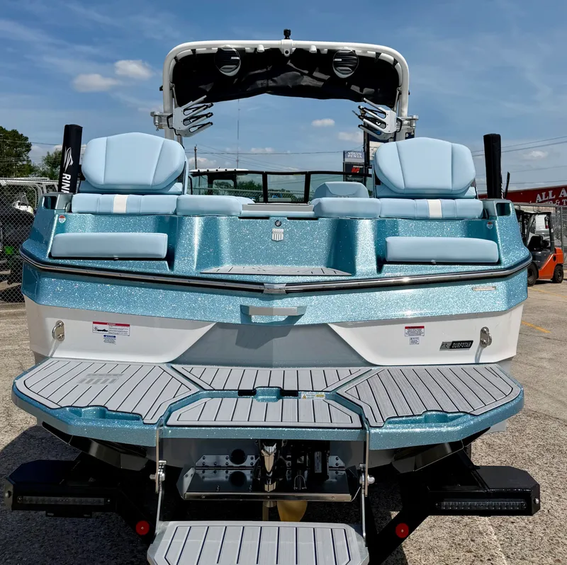 Slide: The Image of Rear view of 2026 MasterCraft XT24 boat at dock. - 11