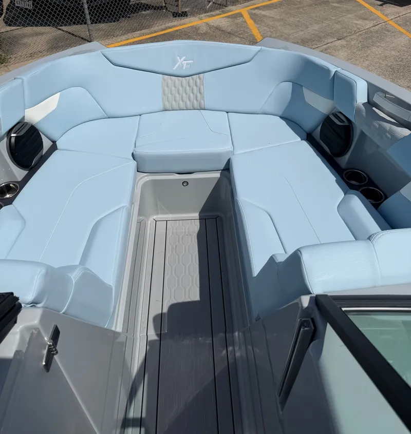 Slide: The Image of Interior of 2026 MasterCraft XT24 boat with blue upholstery. - 15