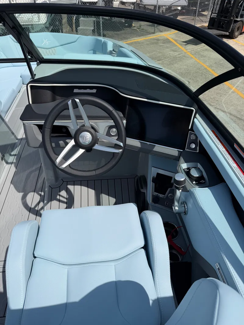 Slide: The Image of Interior of 2026 MasterCraft XT24 with modern helm station. - 17