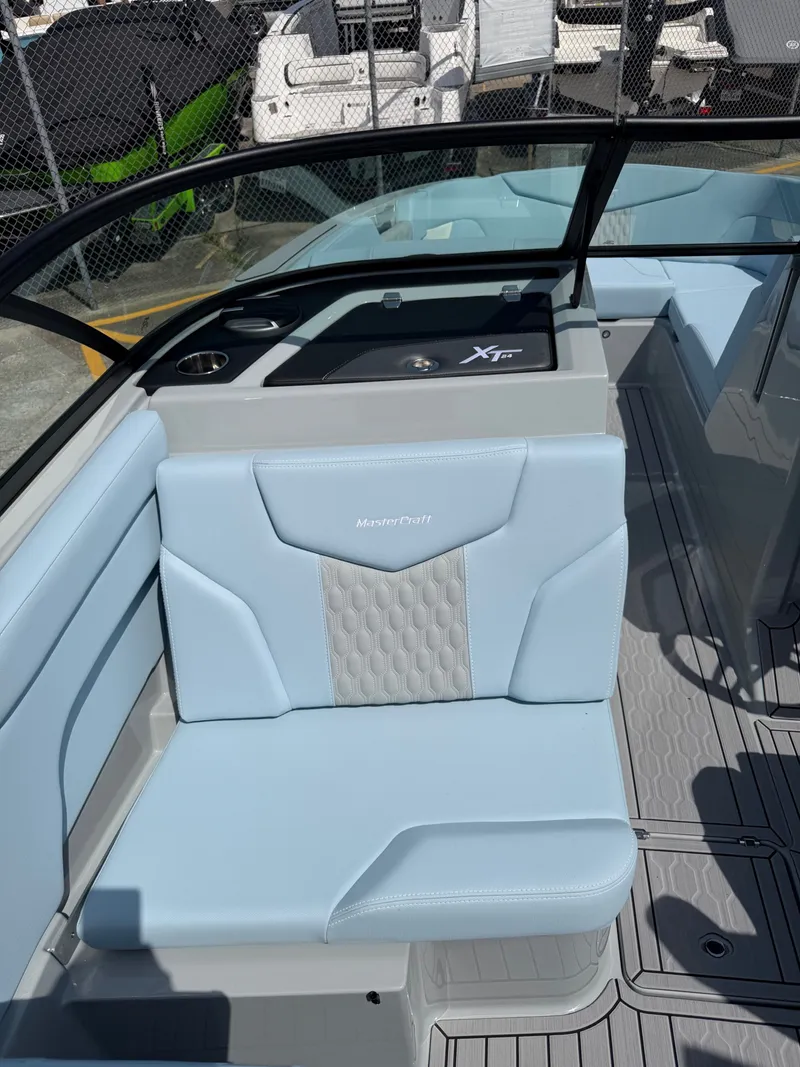 Slide: The Image of Interior of 2026 MasterCraft XT24 with blue seating. - 18