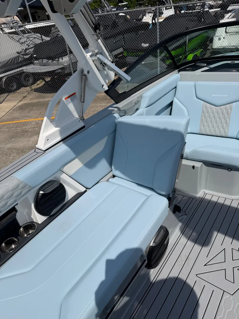 Slide: The Image of Interior of 2026 MasterCraft XT24 with blue seating. - 19