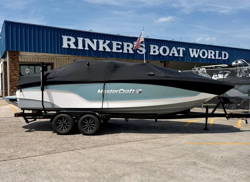 Slide: The Image of 2026 MasterCraft XT24 boat at Rinker's Boat World. - 2