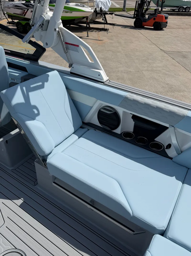 Slide: The Image of Interior of 2026 MasterCraft XT24 with blue seating. - 20