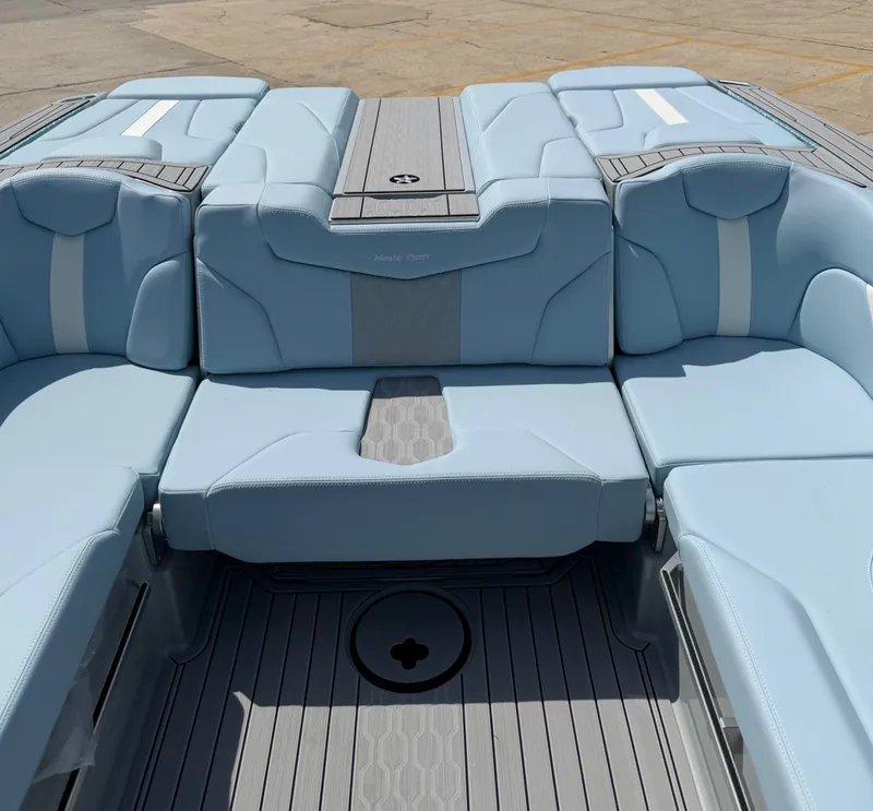Slide: The Image of Interior of 2026 MasterCraft XT24 boat with blue upholstery. - 22