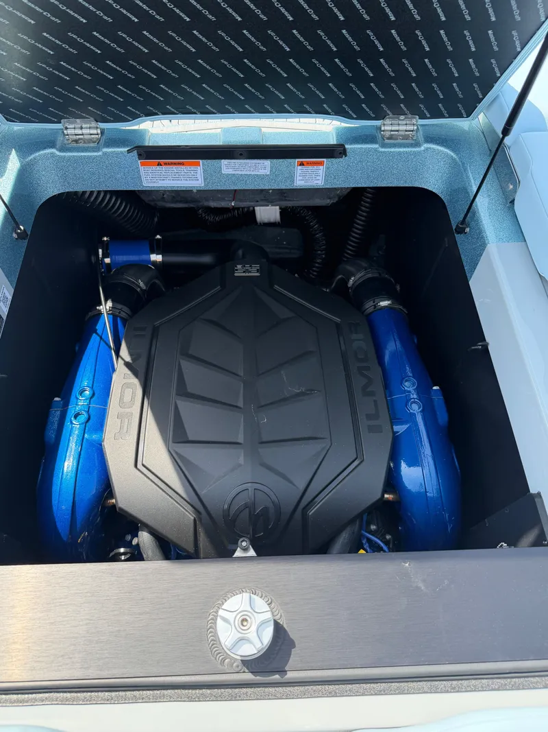 Slide: The Image of Engine compartment of 2026 MasterCraft XT24 with powerful Ilmor engine. - 24