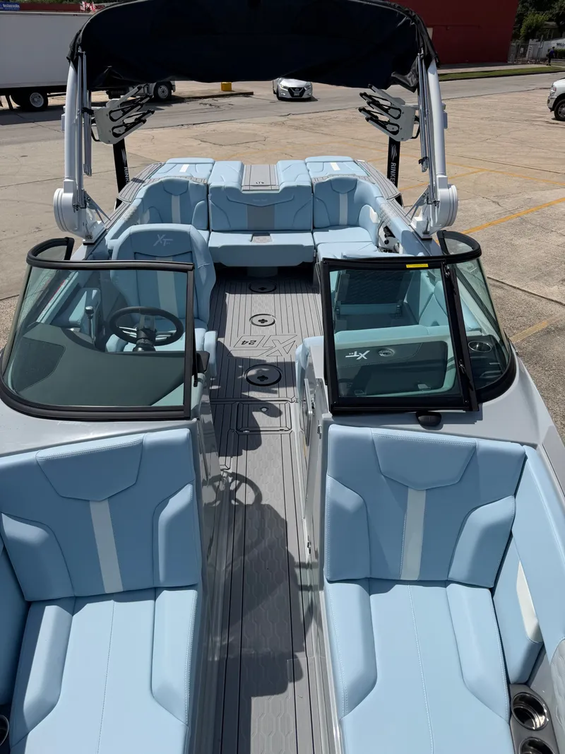 Slide: The Image of Interior of 2026 MasterCraft XT24 boat with blue seating. - 8