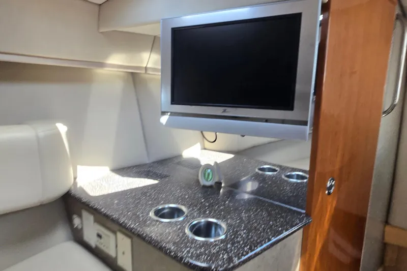 Slide: The Image of Interior of 2005 Formula 330 Sun Sport with TV and countertop. - 10