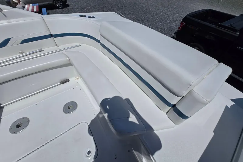 Slide: The Image of 2005 Formula 330 Sun Sport boat interior with white seating and blue accents. - 12