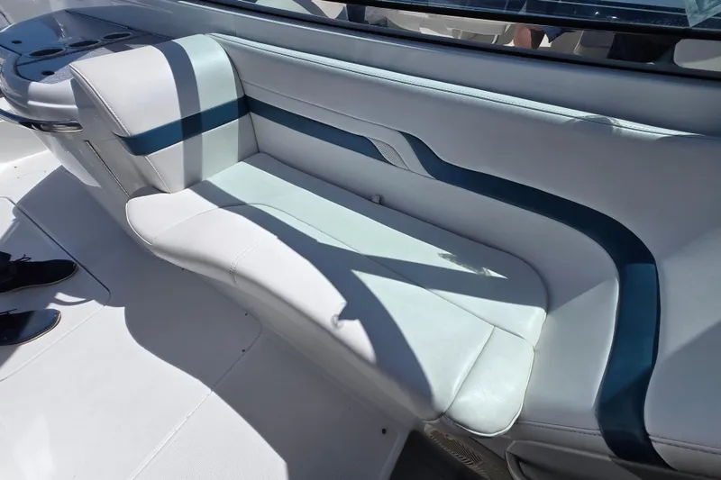 Slide: The Image of 2005 Formula 330 Sun Sport boat interior with white and blue seating. - 16