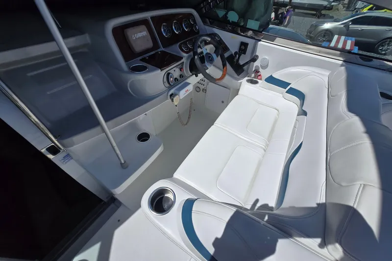 Slide: The Image of 2005 Formula 330 Sun Sport boat interior with white seating and modern dashboard controls. - 17